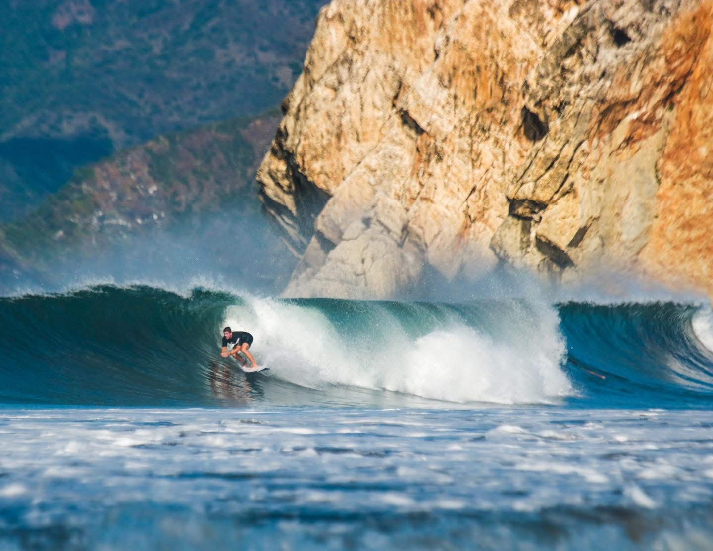Surfing a barrel wave on the Costa Rican coast